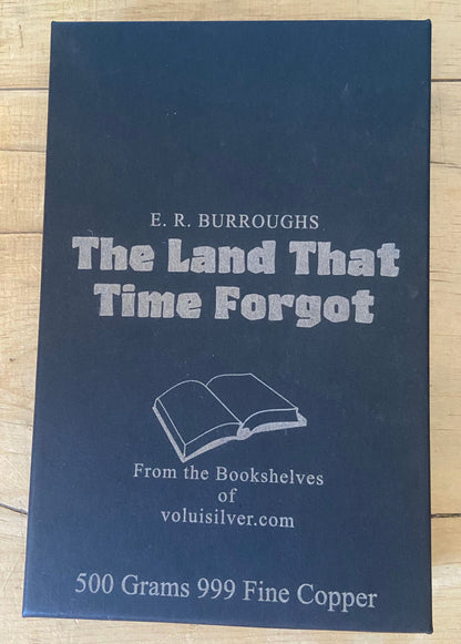 A dark blue book titled 'The Land That Time Forgot' by E. R.